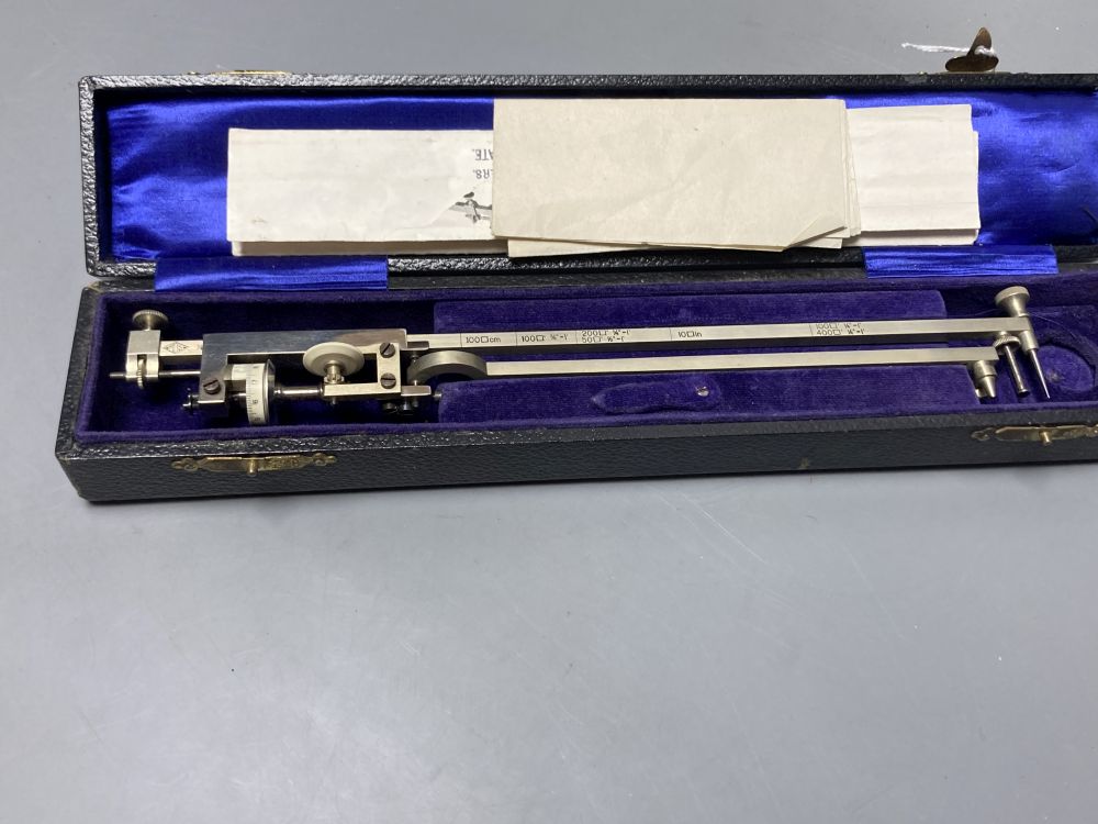 A vintage polished steel planimeter by M.D.S, cased with illustrations